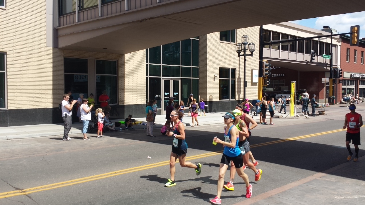 Amelia Gapin running in downtown Duluth during Grandma's Marathon.
